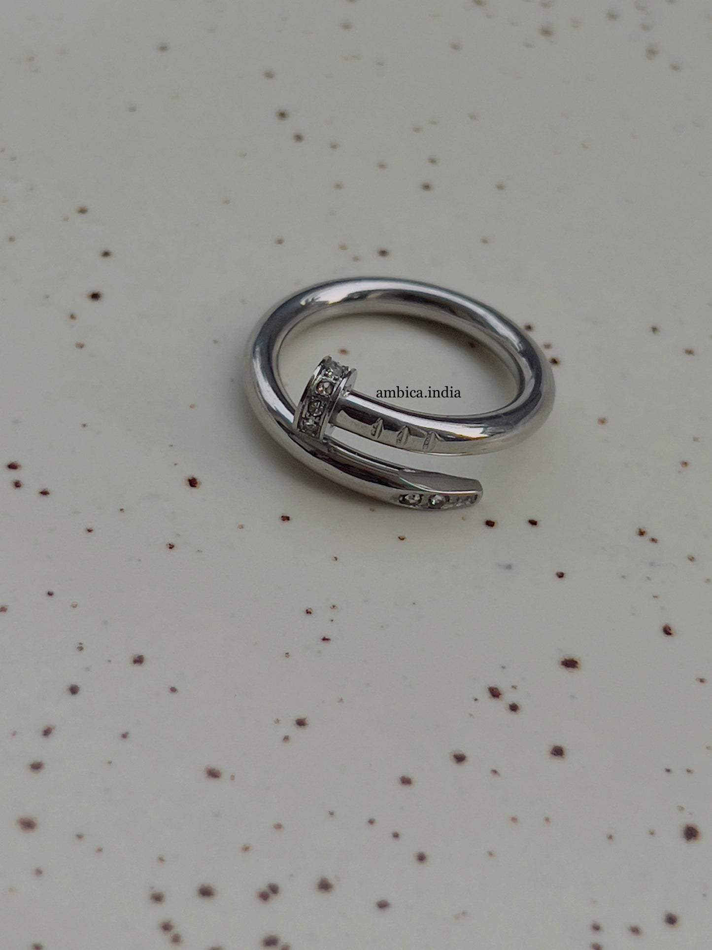 Nail ring with studded silver