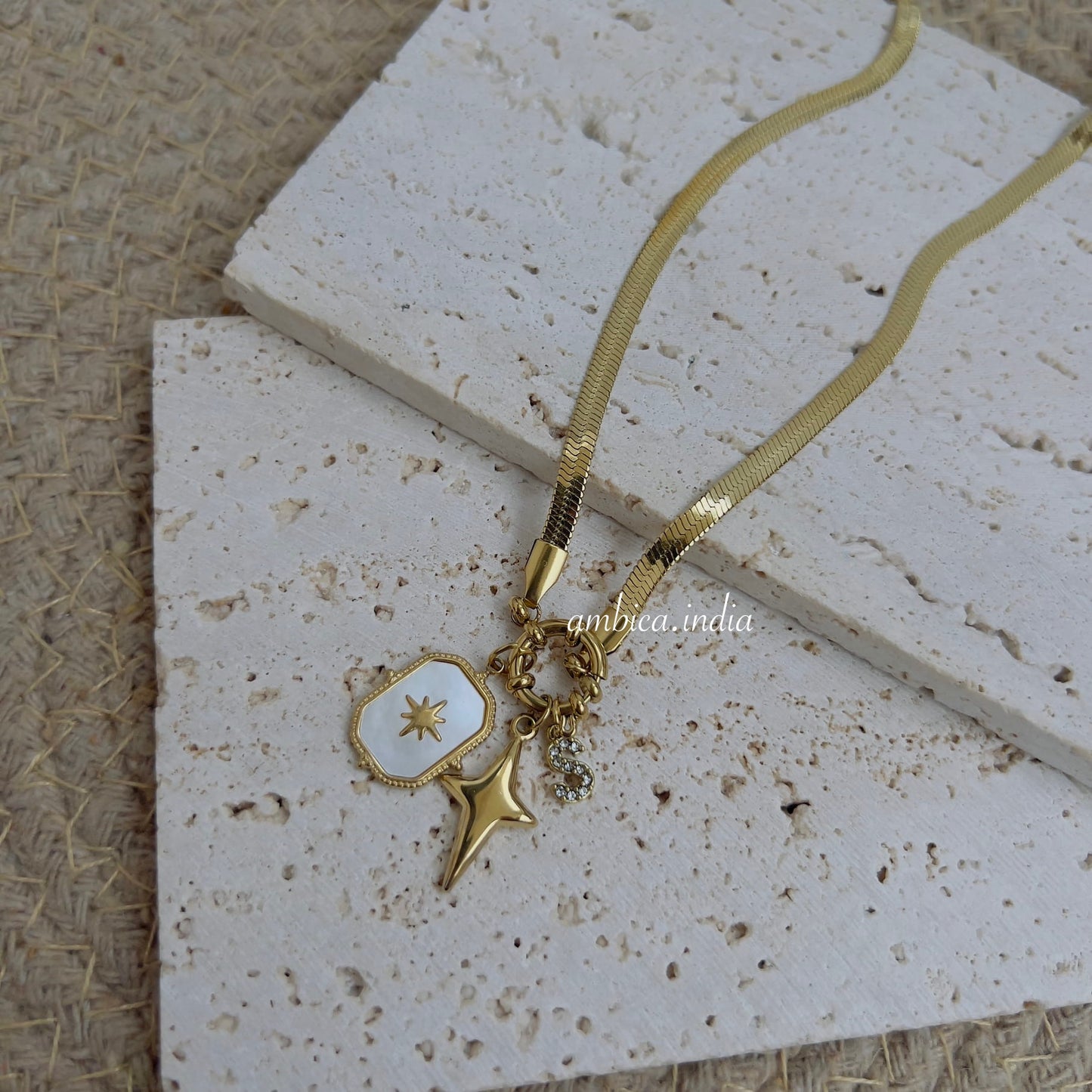 Snake chain with sun & S charm necklace