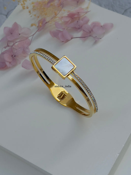 White stone with studded bracelet gold plated