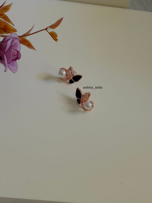 Black butterfly with pearl earrings