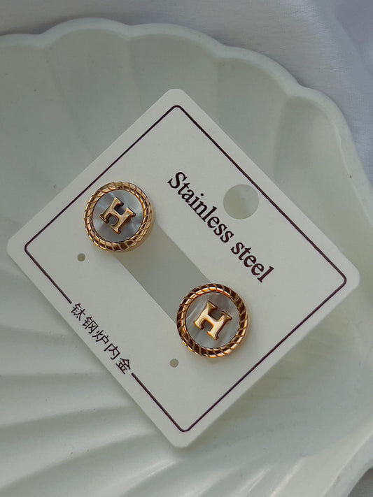 White H earrings