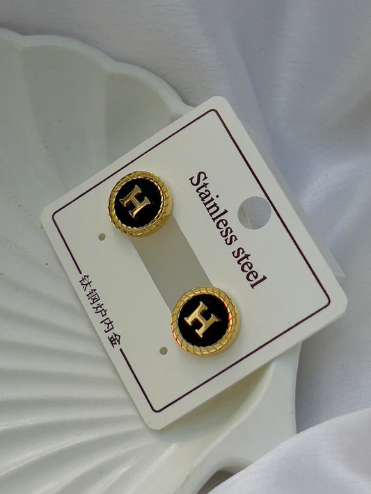 Black H earrings