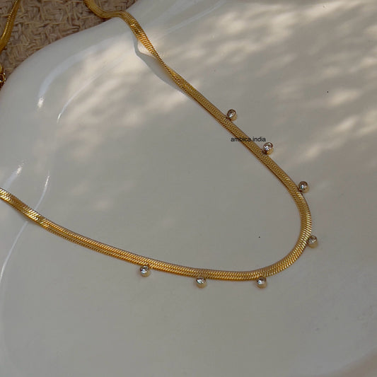 Small white crystal with snake chain