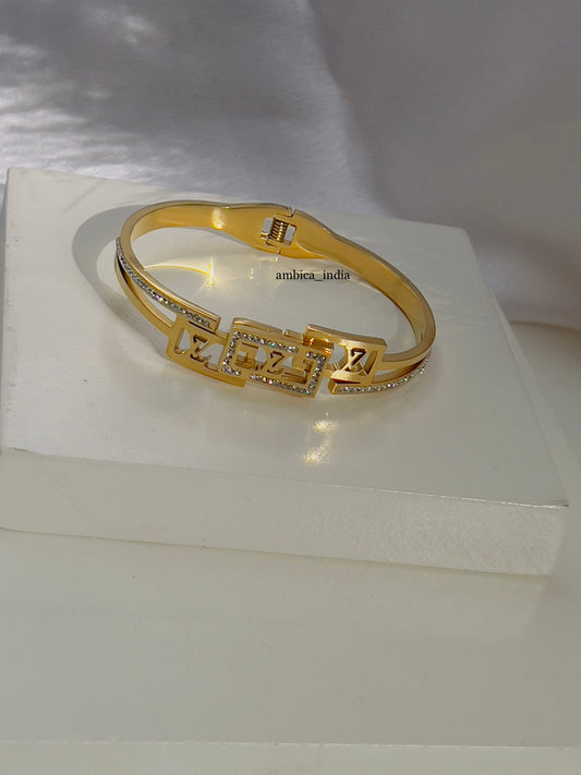 Lv with studded bracelet