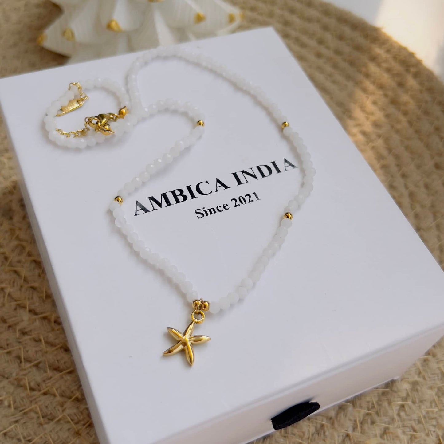 Star with white stone necklace